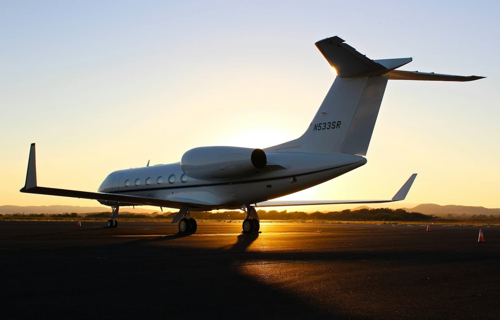 Private jet on tarmac at dusk